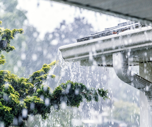 Image showing heavy rainfall on a residential roof's eavestroughs